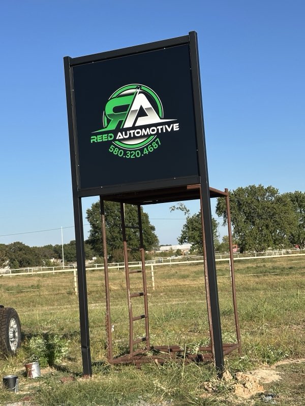 Reed Automotive road sign on Highway 19